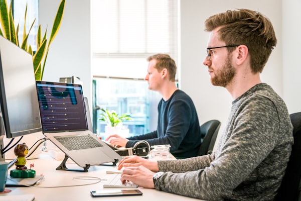 IT professionals working at a modern support workspace